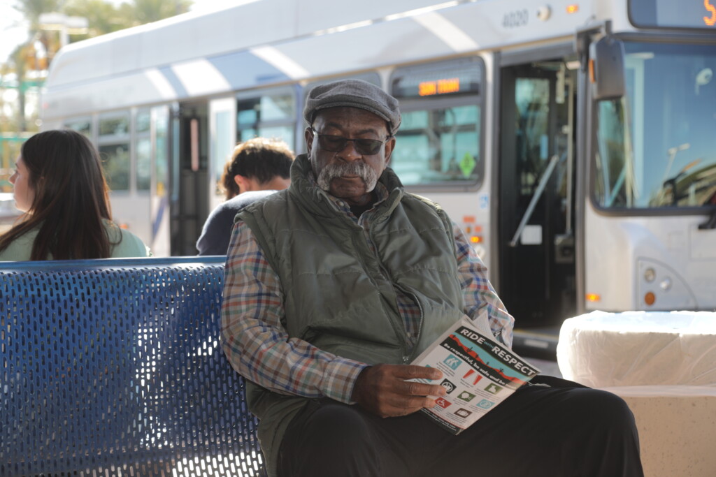 older adult at transit center